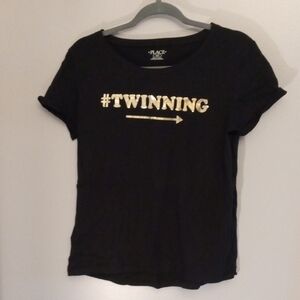 Place Black Tee with Gold Hashtag Design